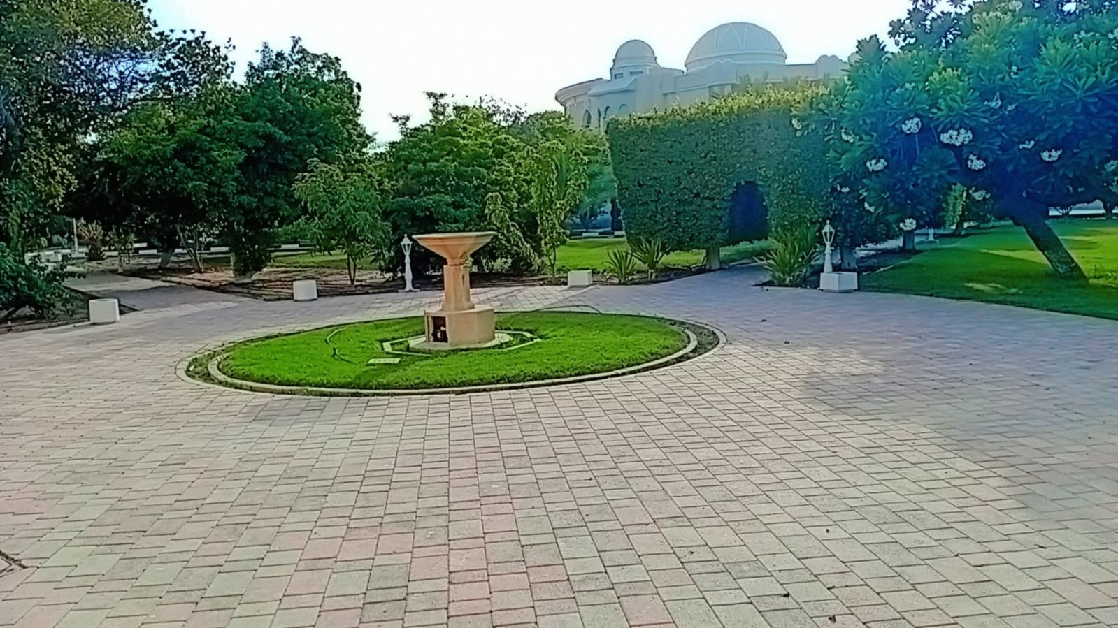 Paved courtyard and stone water feature